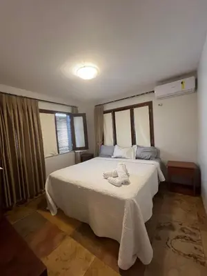 Uma cama ou camas num quarto em Bangalô Superior - Conforto em Flecheiras Aquarium