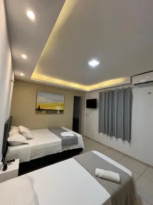 Uma cama ou camas num quarto em Suítes Nativa