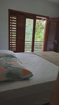 Uma cama ou camas num quarto em Paraíso no coração de Guaramiranga