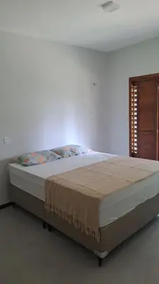 Uma cama ou camas num quarto em Paraíso no coração de Guaramiranga