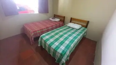Uma cama ou camas num quarto em Casa de Praia em Parajuru