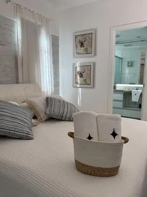 Uma cama ou camas num quarto em Apartamento Térreo no Beach Place