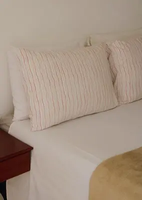 Uma cama ou camas num quarto em Villa Veríssimo Paracuru