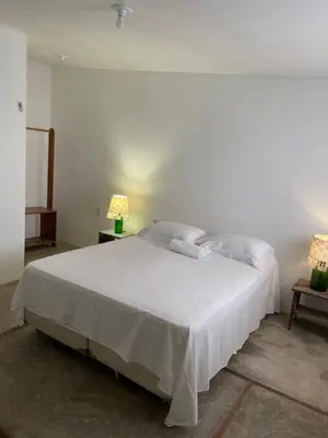 Uma cama ou camas num quarto em Na Casa Dela Clan