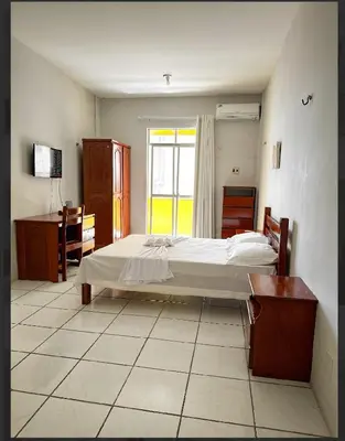 Uma cama ou camas num quarto em Hotel e Flat Sobral Mundi