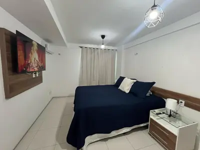 Uma cama ou camas num quarto em Apartamento a dois passos da beira mar