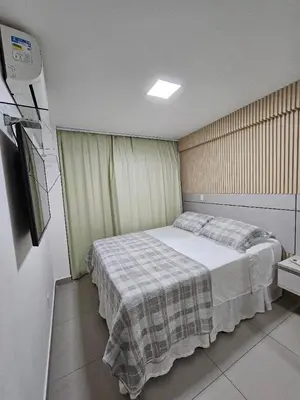 Uma cama ou camas num quarto em KQ 64 - Beira-Mar com Estilo Apê 2 Quartos Aconchegante em Fortaleza
