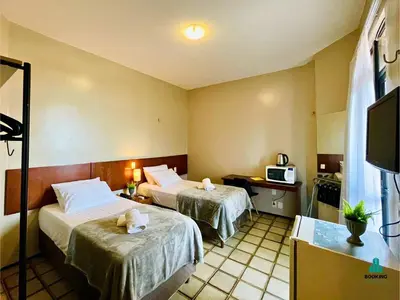 Uma cama ou camas num quarto em Golden Flats Beira Mar by Holiday Stays