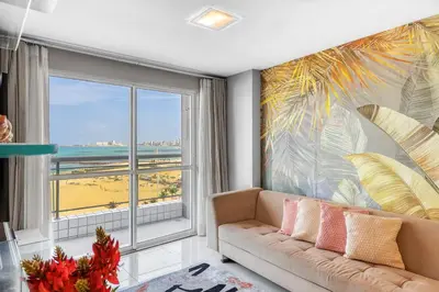 Uma área de estar em Apartamento Vista Mar