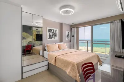 Uma cama ou camas num quarto em Apartamento Vista Mar