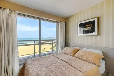 Uma cama ou camas num quarto em Apartamento Vista Mar