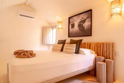 Uma cama ou camas num quarto em Pousada Vina