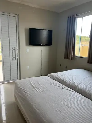 Uma cama ou camas num quarto em Casa Duplex PECEM