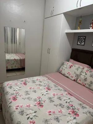 Uma cama ou camas num quarto em Encanto Parangaba