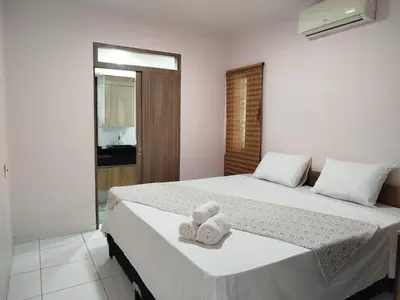 Uma cama ou camas num quarto em Frente mar cumbuco