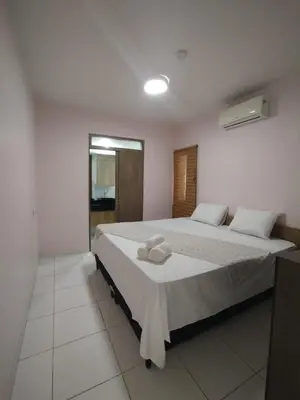 Uma cama ou camas num quarto em Frente mar cumbuco