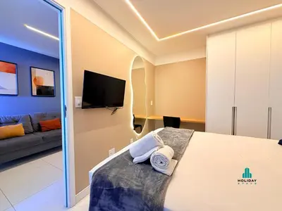 Uma cama ou camas num quarto em Aquarius Style by Holiday Stays