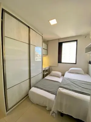 Uma cama ou camas num quarto em Nobless Flat Beira Mar