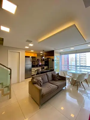 Uma área de estar em Nobless Flat Beira Mar