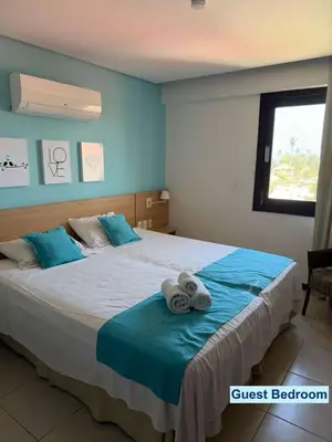 Uma cama ou camas num quarto em Kariri Beach Residence