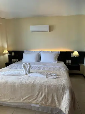 Uma cama ou camas num quarto em Kariri Beach Residence