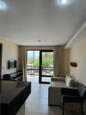 Uma área de estar em Kariri Beach Residence