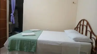 Uma cama ou camas num quarto em House das Rosas