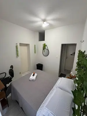 Uma cama ou camas num quarto em Suite em apartamento compartilhado em Meireles, Fortaleza