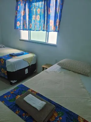 Uma cama ou camas num quarto em Hospedagem para a família perto do mar do Cumbuco
