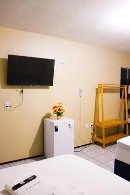 Uma televisão e/ou sistema de entretenimento em Pousada Dom Manuel - Ce