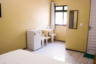 Uma cama ou camas num quarto em Pousada Dom Manuel - Ce