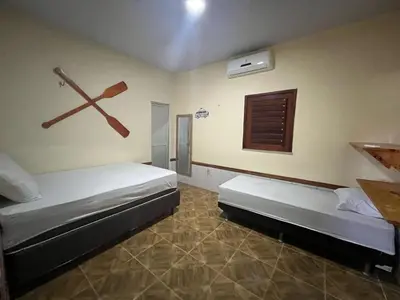 Uma cama ou camas num quarto em Casa Rumaré