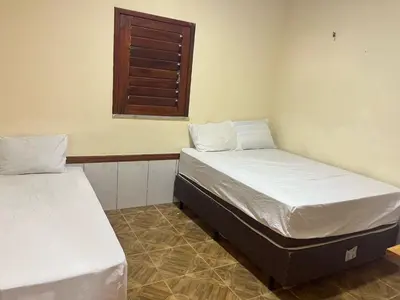 Uma cama ou camas num quarto em Casa Rumaré