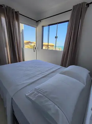 Uma cama ou camas num quarto em Casa Paraiso de Canoa