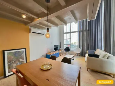 Uma área de estar em Loft Praia - Meireles