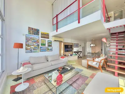 Uma área de estar em Loft Praia - Meireles