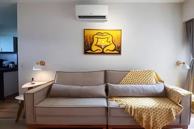 Uma área de estar em BP207 - Apartamento novo e arejado no Cumbuco com Wi-Fi por Will Stay
