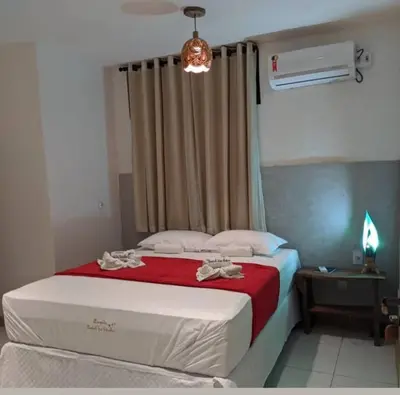 Uma cama ou camas num quarto em Pousada pontal das estrelas