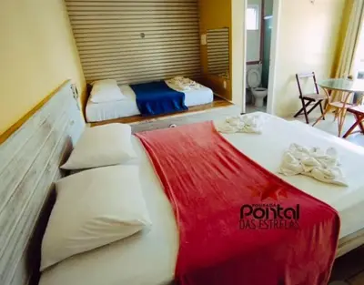 Uma cama ou camas num quarto em Pousada pontal das estrelas