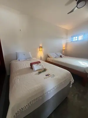 Uma cama ou camas num quarto em Aquarela Lofts em Icaraizinho