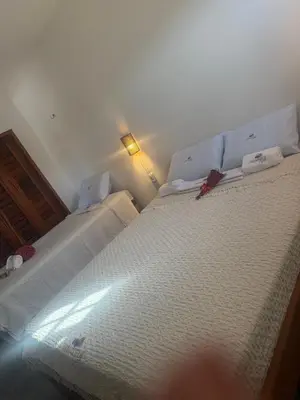 Uma cama ou camas num quarto em Aquarela Lofts em Icaraizinho