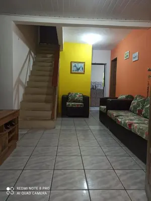 Uma área de estar em Chácara da Lilian