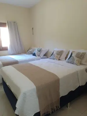 Uma cama ou camas num quarto em Casa Aconchego da Serra - Pacoti