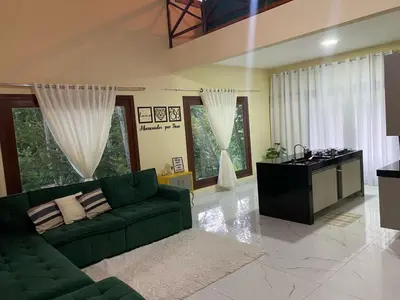Uma área de estar em Casa Aconchego da Serra - Pacoti