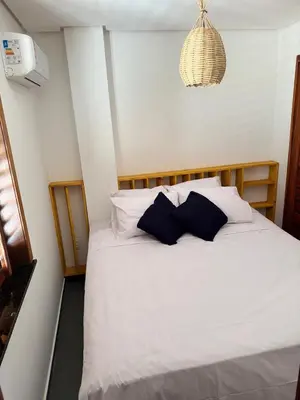 Uma cama ou camas num quarto em Vila Dos Ventos