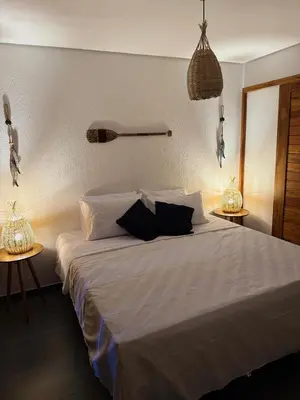 Uma cama ou camas num quarto em Vila Dos Ventos