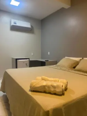 Uma cama ou camas num quarto em Villa brisa icaraizinho Quarto 6 andar superior