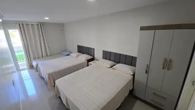 Uma cama ou camas num quarto em Apartamento em Solarium Residence