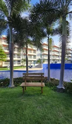 Um jardim no exterior de Apartamento em Solarium Residence