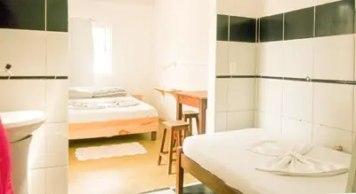 Uma cama ou camas num quarto em Hostel Jericoacoariano
